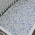 Farm Toile Muslin Crib Sheet | Transform your baby's crib into a cozy haven with our Farm Toile Muslin Crib Sheet. Crafted from our exclusive soft and breathable muslin fabric, this sheet showcases a neutral design that adds a touch of warmth and style to