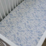 Farm Toile Muslin Crib Sheet | Transform your baby's crib into a cozy haven with our Farm Toile Muslin Crib Sheet. Crafted from our exclusive soft and breathable muslin fabric, this sheet showcases a neutral design that adds a touch of warmth and style to