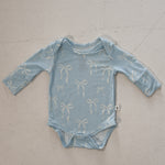 Blue Bows | Long Sleeve Bamboo Snapsuit | Made from the softest premium bamboo in our classic solid black, this snapsuit is cozy, durable, and easy to wear all day long. Designed for sleeping, playing, and everything in between, it features snap closures