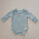 Blue Bows | Long Sleeve Bamboo Snapsuit | Made from the softest premium bamboo in our classic solid black, this snapsuit is cozy, durable, and easy to wear all day long. Designed for sleeping, playing, and everything in between, it features snap closures