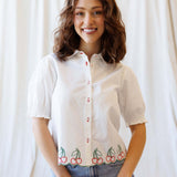 Cherry Cute Button Down blouse featuring cherry embroidery and puff sleeves, perfect for nursing friendly styles.