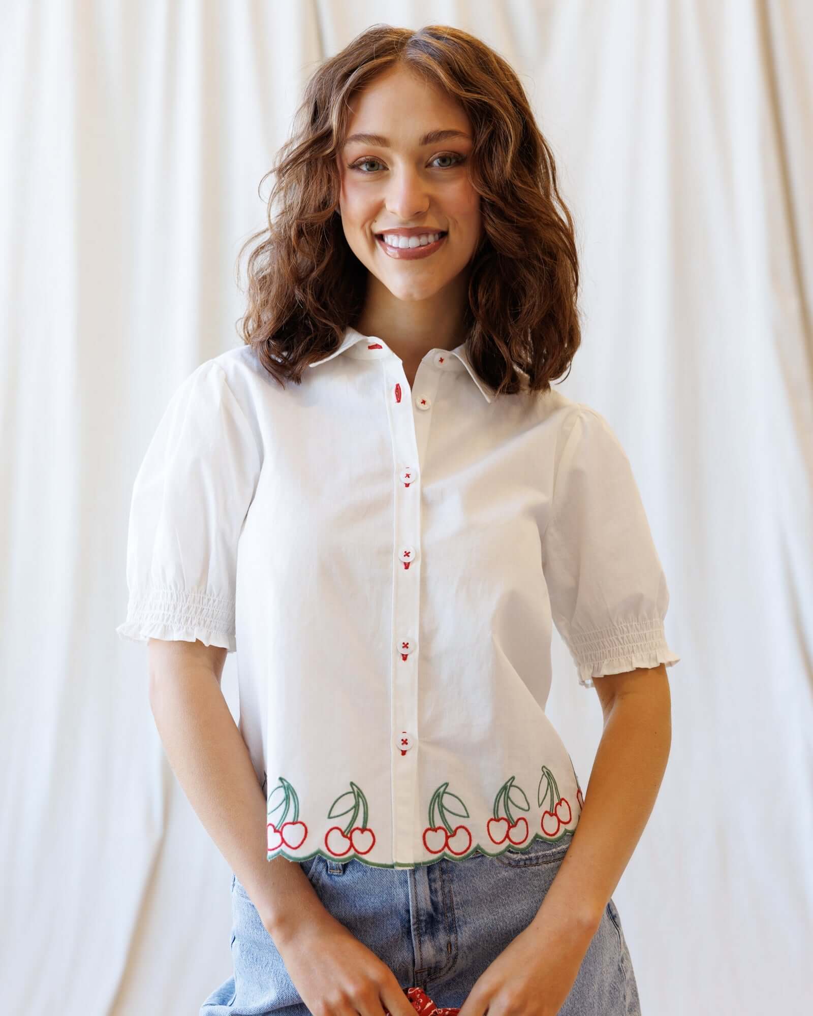 Cherry Cute Button Down blouse featuring cherry embroidery and puff sleeves, perfect for nursing friendly styles.