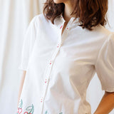Cherry Cute Button Down blouse with cherry embroidery and puff sleeves, perfect for nursing friendly style.