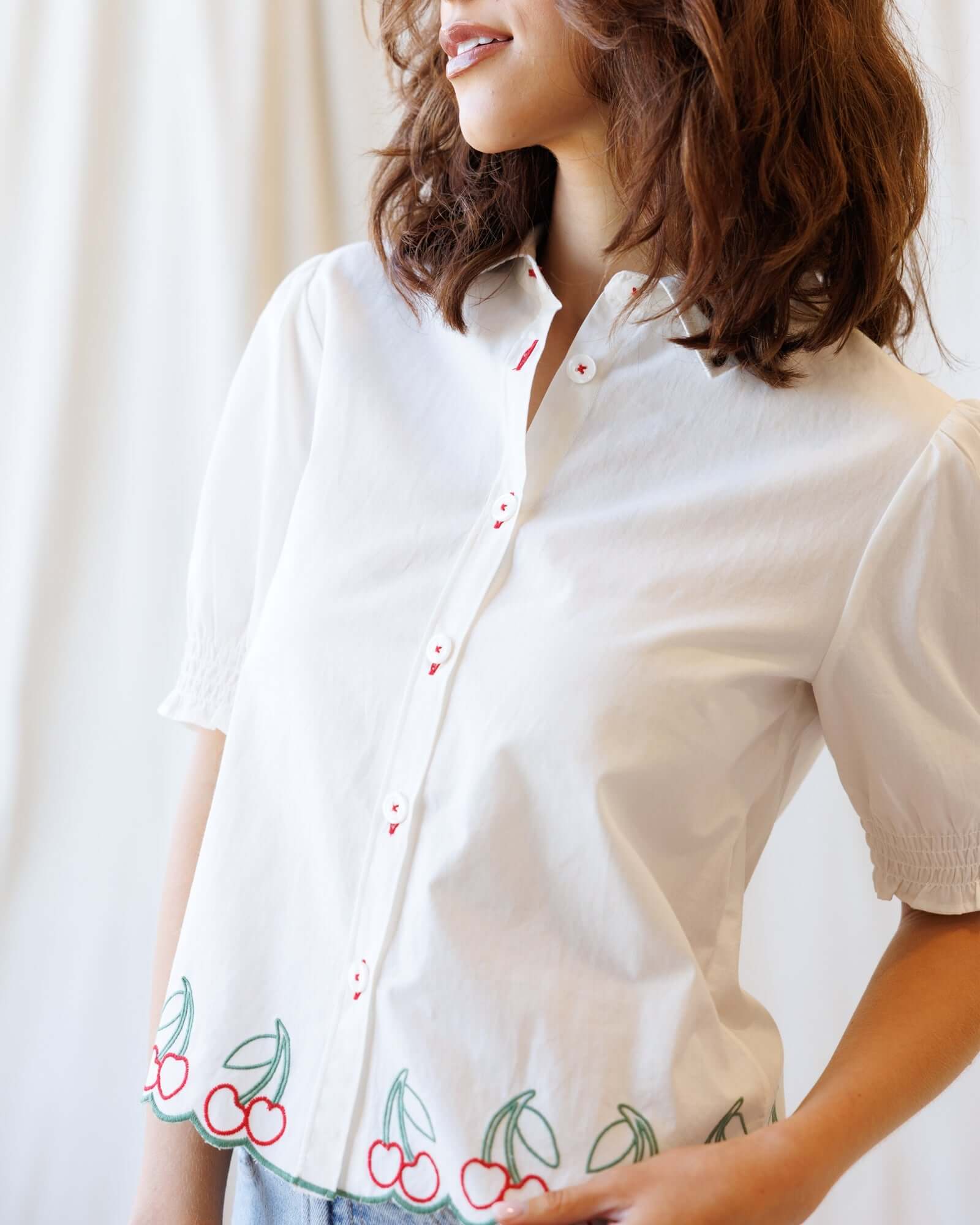 Cherry Cute Button Down blouse with cherry embroidery and puff sleeves, perfect for nursing friendly style.