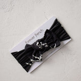 Midnight Skelly | Bamboo Head Wrap | Discover the Bamboo Head Wrap, crafted from silky-soft bamboo, perfect for babies and toddlers! Stylish and comfy for every occasion! | Milk & Baby