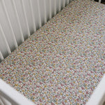 Sunny Petals Muslin Crib Sheet | Transform your baby's crib into a cozy haven with our Sunny Petals Muslin Crib Sheet. Crafted from our exclusive soft and breathable muslin fabric, this sheet showcases a neutral design that adds a touch of warmth and styl