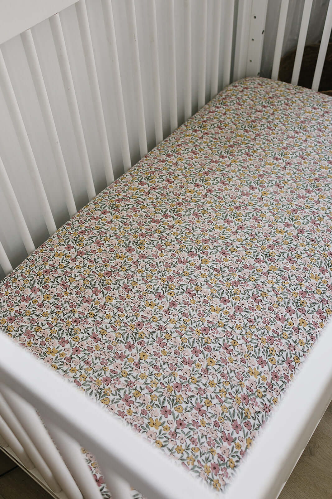 Sunny Petals Muslin Crib Sheet | Transform your baby's crib into a cozy haven with our Sunny Petals Muslin Crib Sheet. Crafted from our exclusive soft and breathable muslin fabric, this sheet showcases a neutral design that adds a touch of warmth and styl