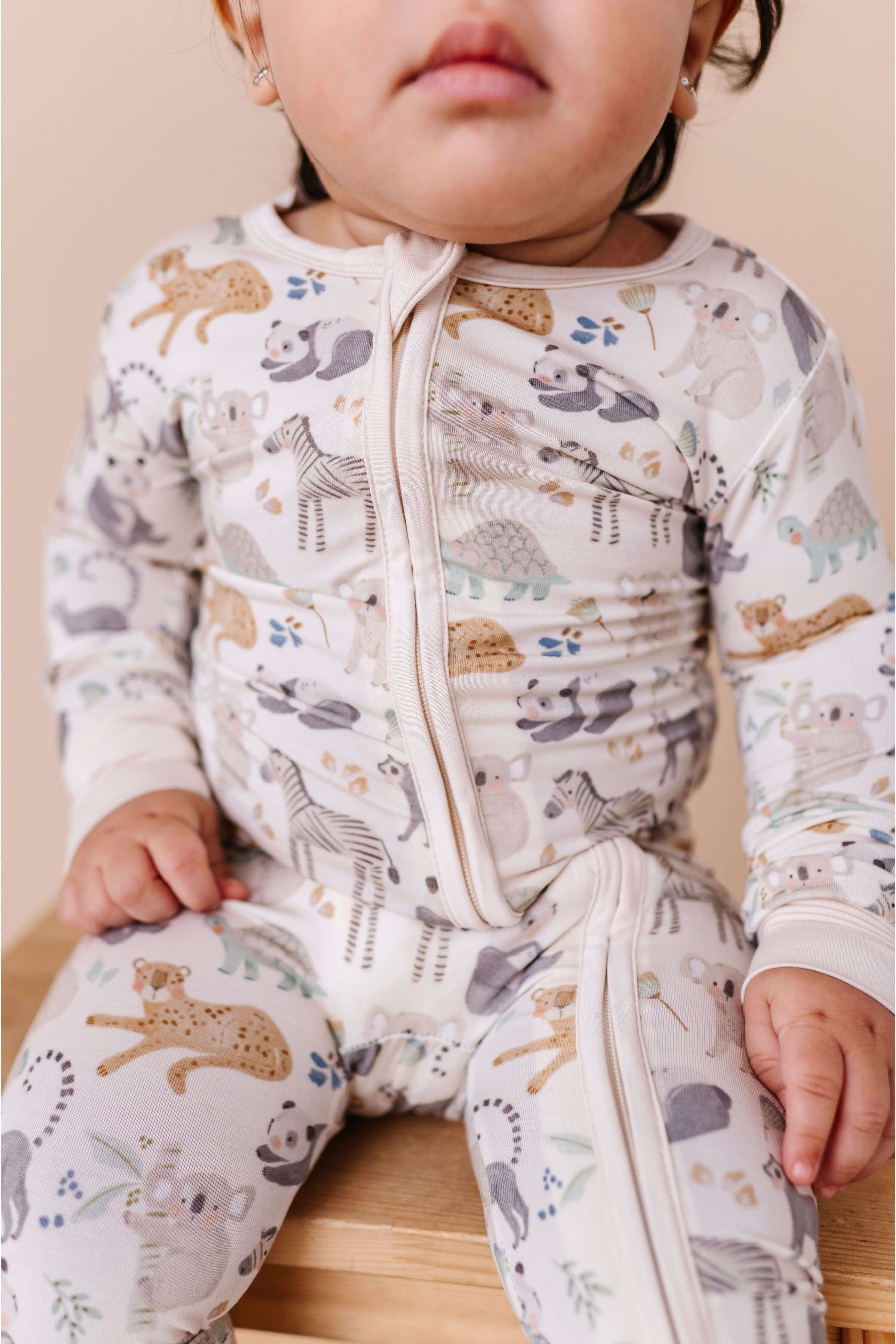 Safari Friends | Bamboo One Piece Zip Pajama | Bamboo Zip Romper – Safari Friends Animal Print Baby One-Piece An ultra-soft bamboo zip romper with an adorable safari animal print, designed for comfort, breathability, and effortless diaper changes. Key Fea