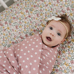 Sunny Petals Muslin Crib Sheet | Transform your baby's crib into a cozy haven with our Sunny Petals Muslin Crib Sheet. Crafted from our exclusive soft and breathable muslin fabric, this sheet showcases a neutral design that adds a touch of warmth and styl