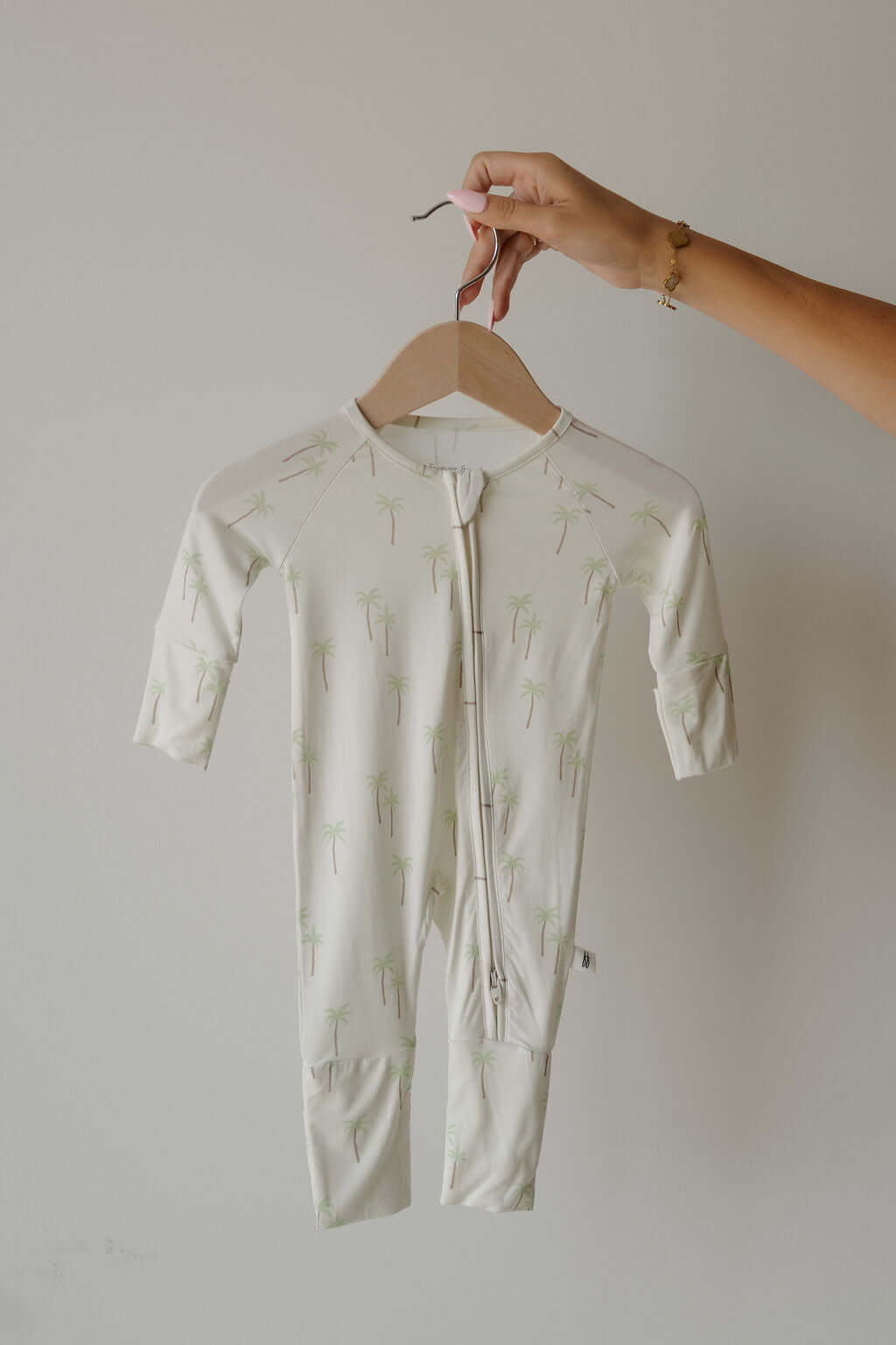 Bamboo Zip Pajamas | Palm | Milk & Baby | Made of the softest premium bamboo. Durable and well designed your little ones can sleep and play in these cozy pajamas. Our smallest sizes have rollover cuffs on the hands and all of the one piece sizes have cuff