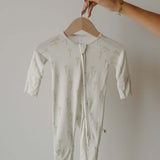 Bamboo Zip Pajamas | Palm | Milk & Baby | Made of the softest premium bamboo. Durable and well designed your little ones can sleep and play in these cozy pajamas. Our smallest sizes have rollover cuffs on the hands and all of the one piece sizes have cuff