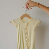 Sunny | Shortie Bamboo Zip | Milk & Baby | Made of the softest premium bamboo. Durable and well designed your little ones can sleep and play in these cozy pajamas. These shortie rompers are ideal for warmer months featuring short sleeves and short bottoms