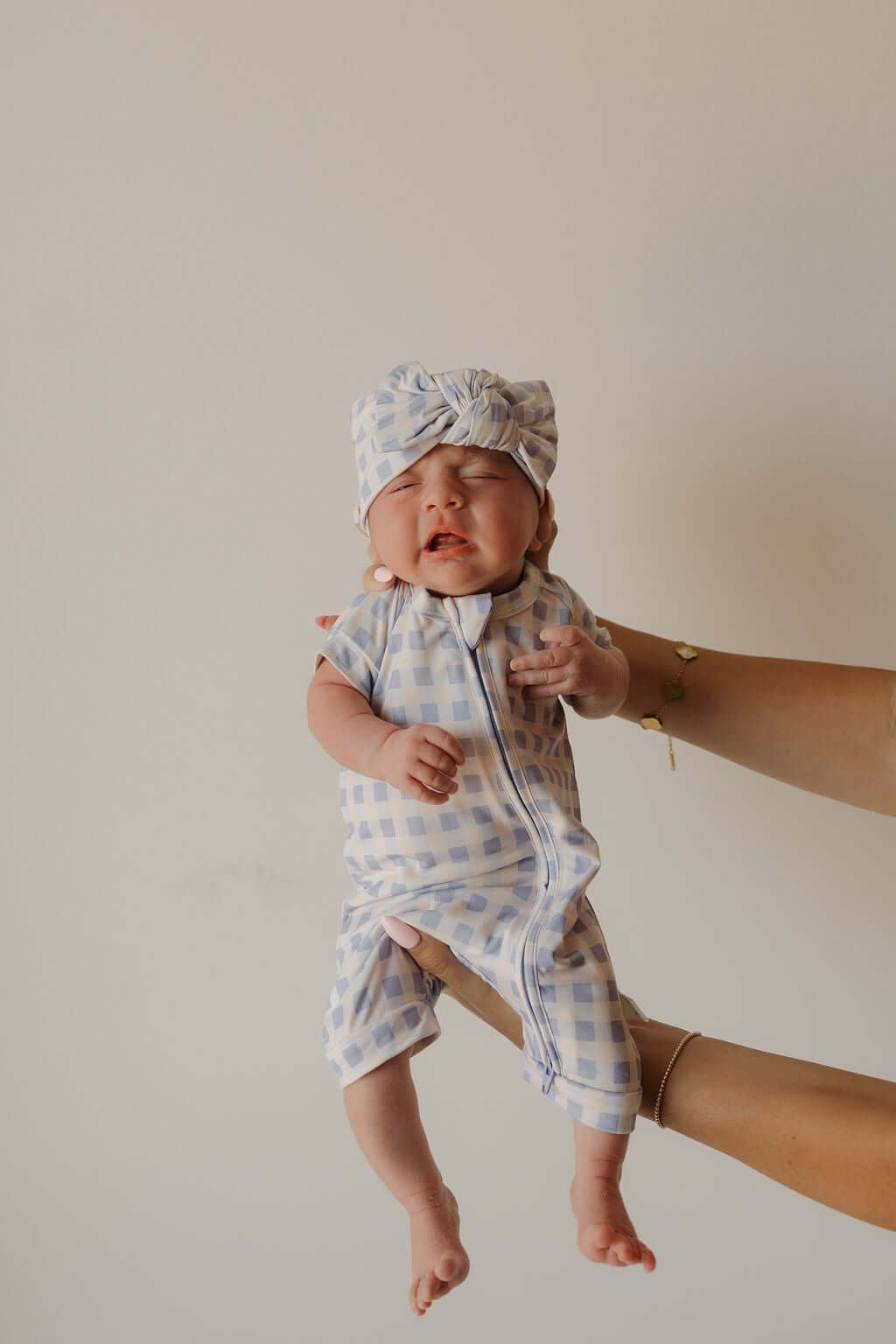 Bamboo Head Wrap | Marilyn | Milk & Baby | Made from silky-soft bamboo material, this adjustable head wrap features a sweet bow for added style. Perfect for babies and toddlers!One size fits most Print: Marilyn (a purple and pink gingham) Material: 95% ba