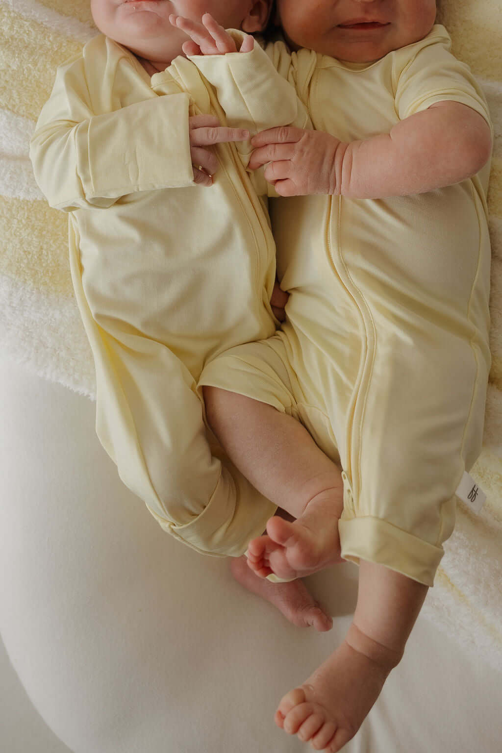 Sunny | Bamboo Zip Pajamas | Milk & Baby | Made of the softest premium bamboo. Durable and well designed your little ones can sleep and play in these cozy pajamas. Our smallest sizes have rollover cuffs on the hands and all of the one piece sizes have cuf