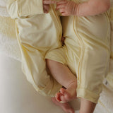 Sunny | Bamboo Zip Pajamas | Milk & Baby | Made of the softest premium bamboo. Durable and well designed your little ones can sleep and play in these cozy pajamas. Our smallest sizes have rollover cuffs on the hands and all of the one piece sizes have cuf