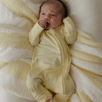 Sunny | Bamboo Zip Pajamas | Milk & Baby | Made of the softest premium bamboo. Durable and well designed your little ones can sleep and play in these cozy pajamas. Our smallest sizes have rollover cuffs on the hands and all of the one piece sizes have cuf
