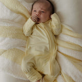 Sunny | Bamboo Zip Pajamas | Milk & Baby | Made of the softest premium bamboo. Durable and well designed your little ones can sleep and play in these cozy pajamas. Our smallest sizes have rollover cuffs on the hands and all of the one piece sizes have cuf