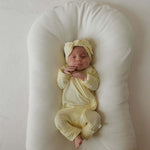 Sunny | Bamboo Head Wrap | Milk & Baby | Made from silky-soft bamboo material, this adjustable head wrap features a sweet bow for added style. Perfect for babies and toddlers!One size fits most Print: Sunny (a solid pale yellow) Material: 95% bamboo visco