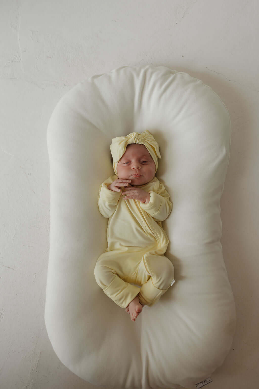 Sunny | Bamboo Head Wrap | Milk & Baby | Made from silky-soft bamboo material, this adjustable head wrap features a sweet bow for added style. Perfect for babies and toddlers!One size fits most Print: Sunny (a solid pale yellow) Material: 95% bamboo visco