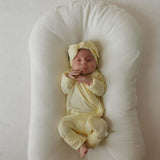 Sunny | Bamboo Head Wrap | Milk & Baby | Made from silky-soft bamboo material, this adjustable head wrap features a sweet bow for added style. Perfect for babies and toddlers!One size fits most Print: Sunny (a solid pale yellow) Material: 95% bamboo visco