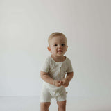 Shortie Bamboo Zip | Palm | Milk & Baby | Made of the softest premium bamboo. Durable and well designed your little ones can sleep and play in these cozy pajamas. These shortie rompers are ideal for warmer months featuring short sleeves and short bottoms.