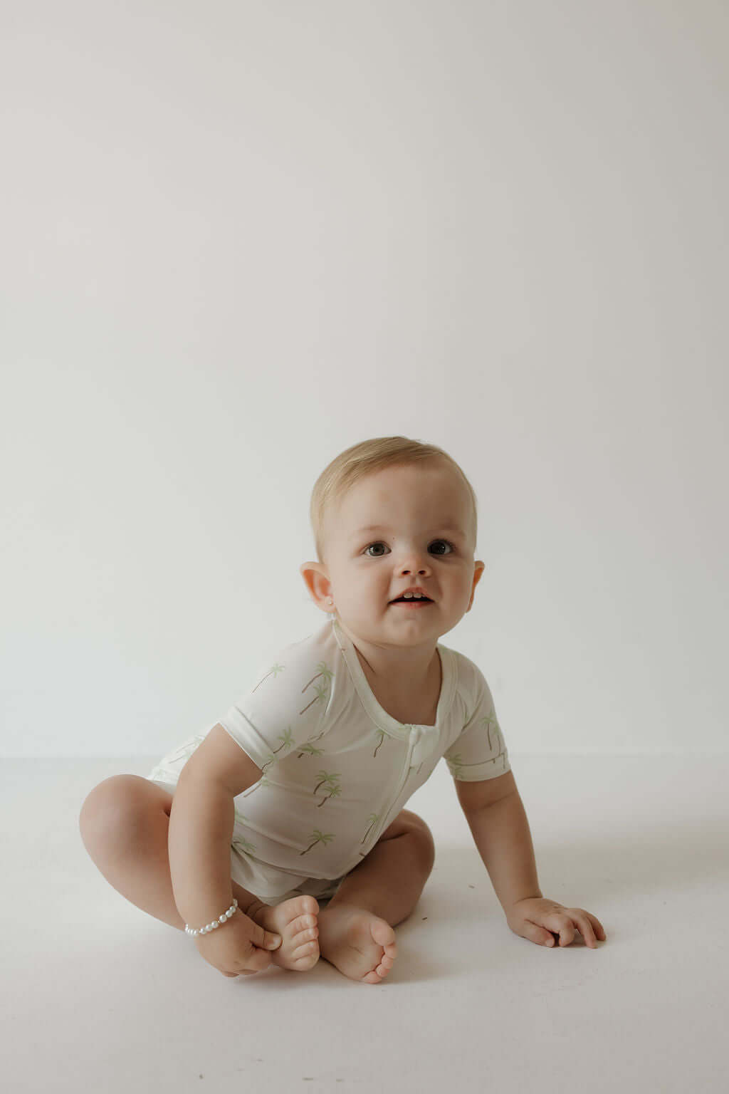 Shortie Bamboo Zip | Palm | Milk & Baby | Made of the softest premium bamboo. Durable and well designed your little ones can sleep and play in these cozy pajamas. These shortie rompers are ideal for warmer months featuring short sleeves and short bottoms.