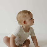 Shortie Bamboo Zip | Palm | Milk & Baby | Made of the softest premium bamboo. Durable and well designed your little ones can sleep and play in these cozy pajamas. These shortie rompers are ideal for warmer months featuring short sleeves and short bottoms.