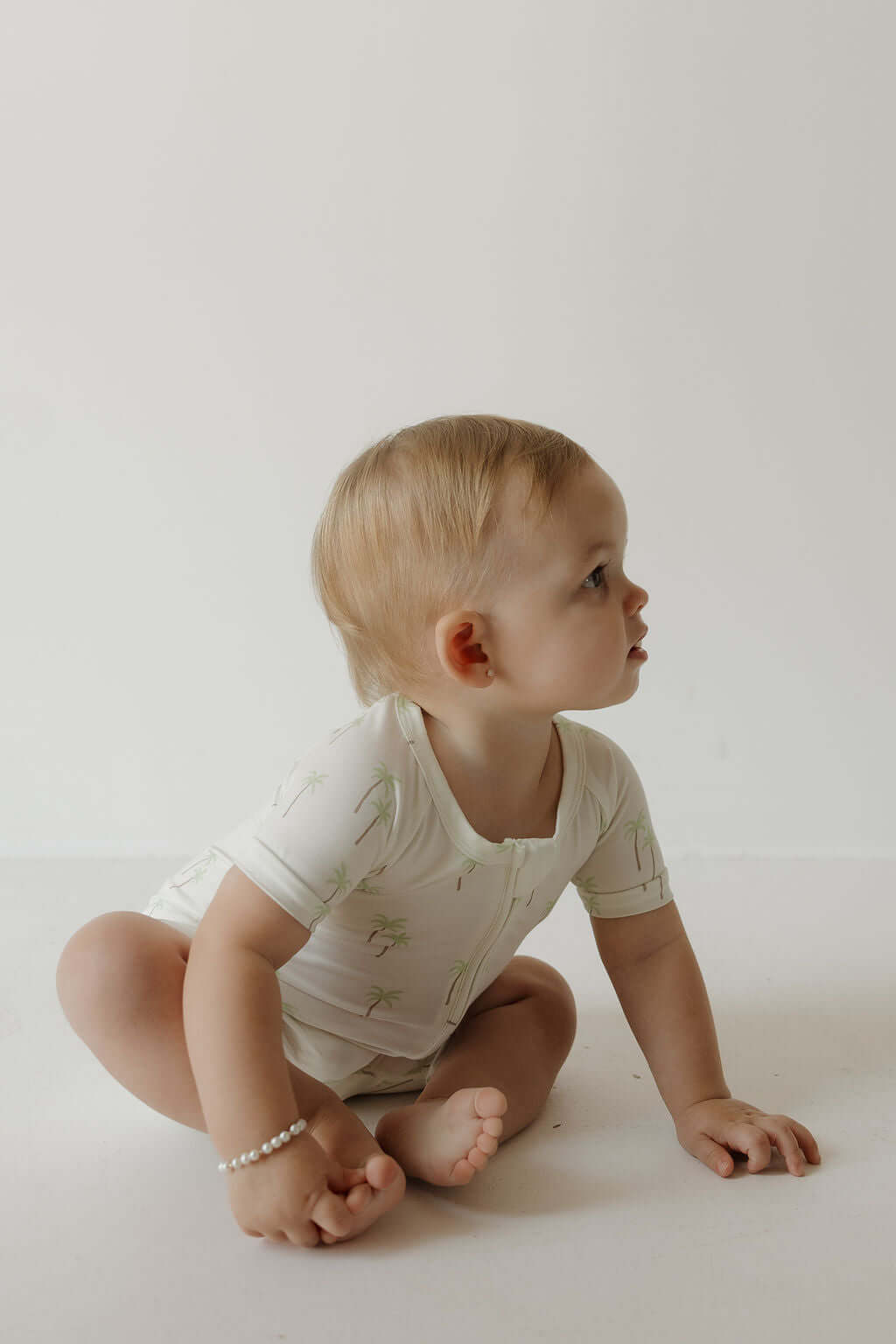 Shortie Bamboo Zip | Palm | Milk & Baby | Made of the softest premium bamboo. Durable and well designed your little ones can sleep and play in these cozy pajamas. These shortie rompers are ideal for warmer months featuring short sleeves and short bottoms.