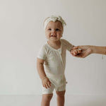 Shortie Bamboo Zip | Palm | Milk & Baby | Made of the softest premium bamboo. Durable and well designed your little ones can sleep and play in these cozy pajamas. These shortie rompers are ideal for warmer months featuring short sleeves and short bottoms.