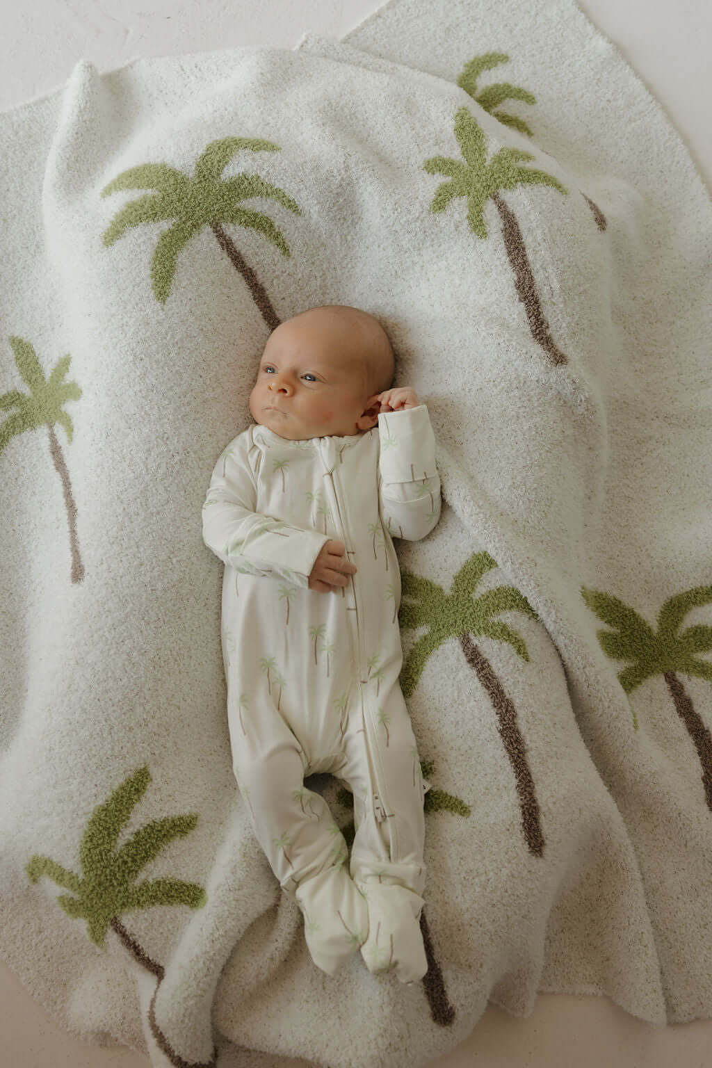 Bamboo Zip Pajamas | Palm | Milk & Baby | Made of the softest premium bamboo. Durable and well designed your little ones can sleep and play in these cozy pajamas. Our smallest sizes have rollover cuffs on the hands and all of the one piece sizes have cuff
