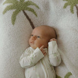 Bamboo Zip Pajamas | Palm | Milk & Baby | Made of the softest premium bamboo. Durable and well designed your little ones can sleep and play in these cozy pajamas. Our smallest sizes have rollover cuffs on the hands and all of the one piece sizes have cuff