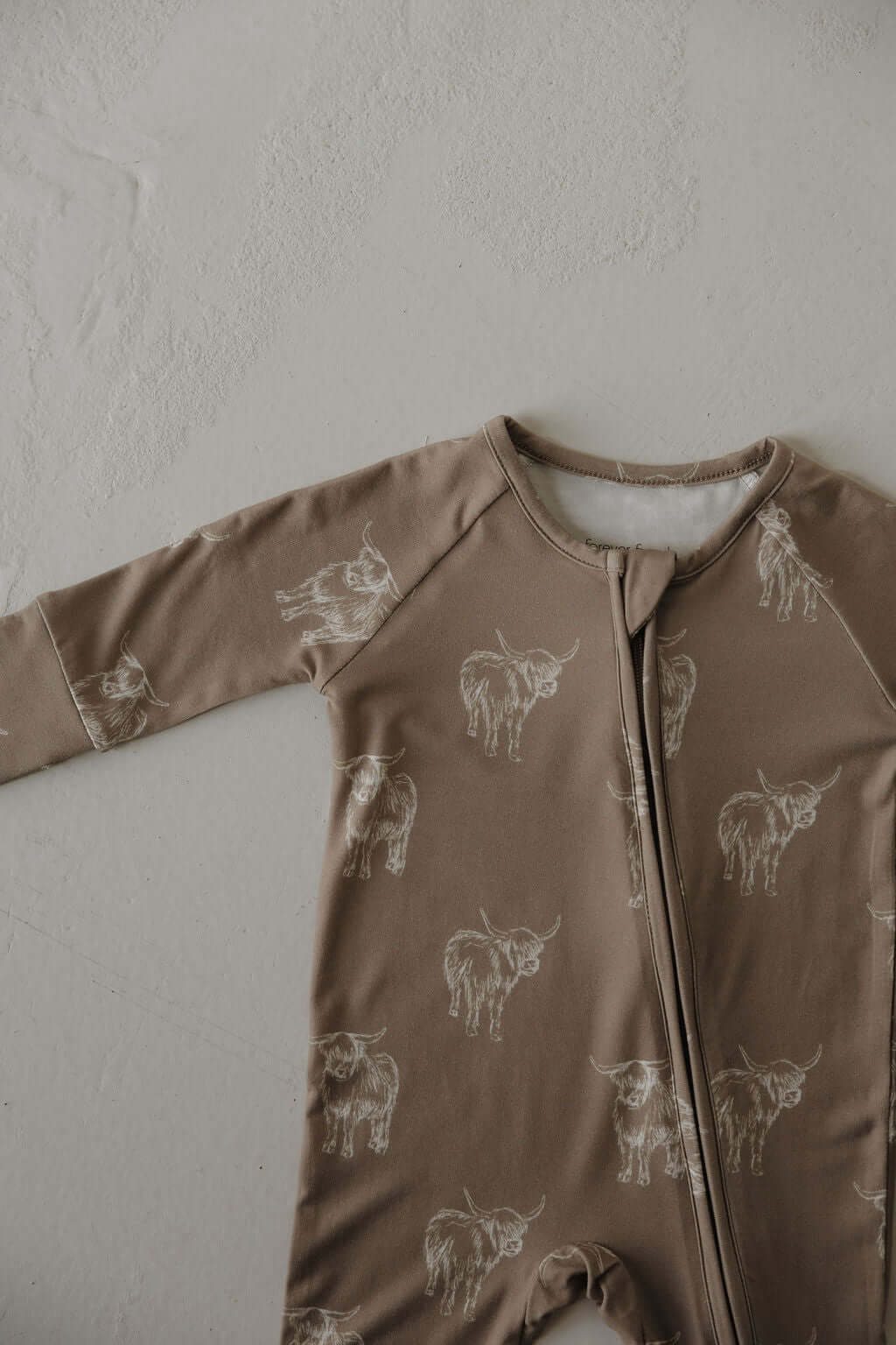 Highland | Bamboo Zip Pajamas | Made of the softest premium bamboo. Durable and well designed your little ones can sleep and play in these cozy pajamas. Our smallest sizes have rollover cuffs on the hands and all of the one piece sizes have cuffs on the f