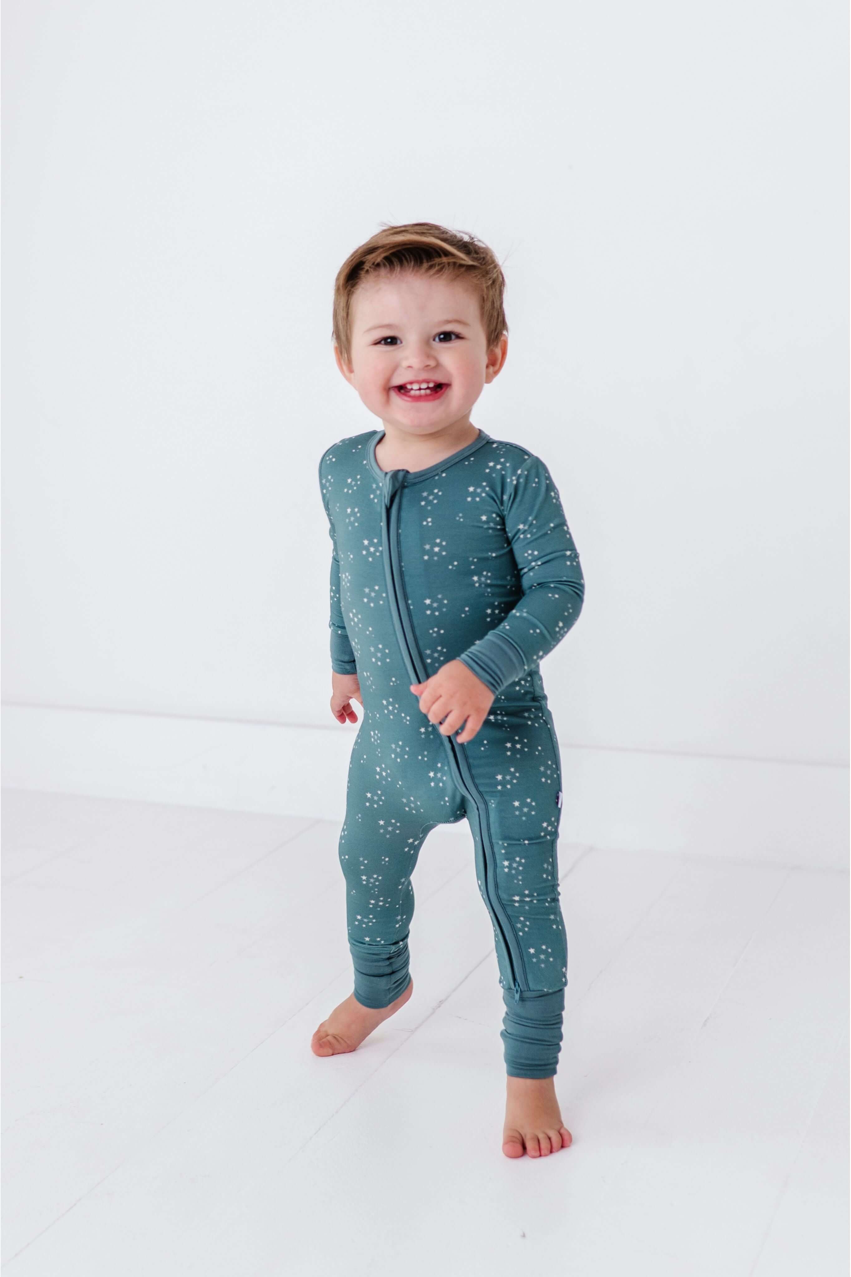 Starlit Sky | Bamboo One Piece Zip Pajama | An ultra-soft bamboo zip romper with an adorable star print, designed for comfort, breathability, and effortless diaper changes. Key Features: 🌱 Made from premium bamboo fabric – naturally soft and breathable �