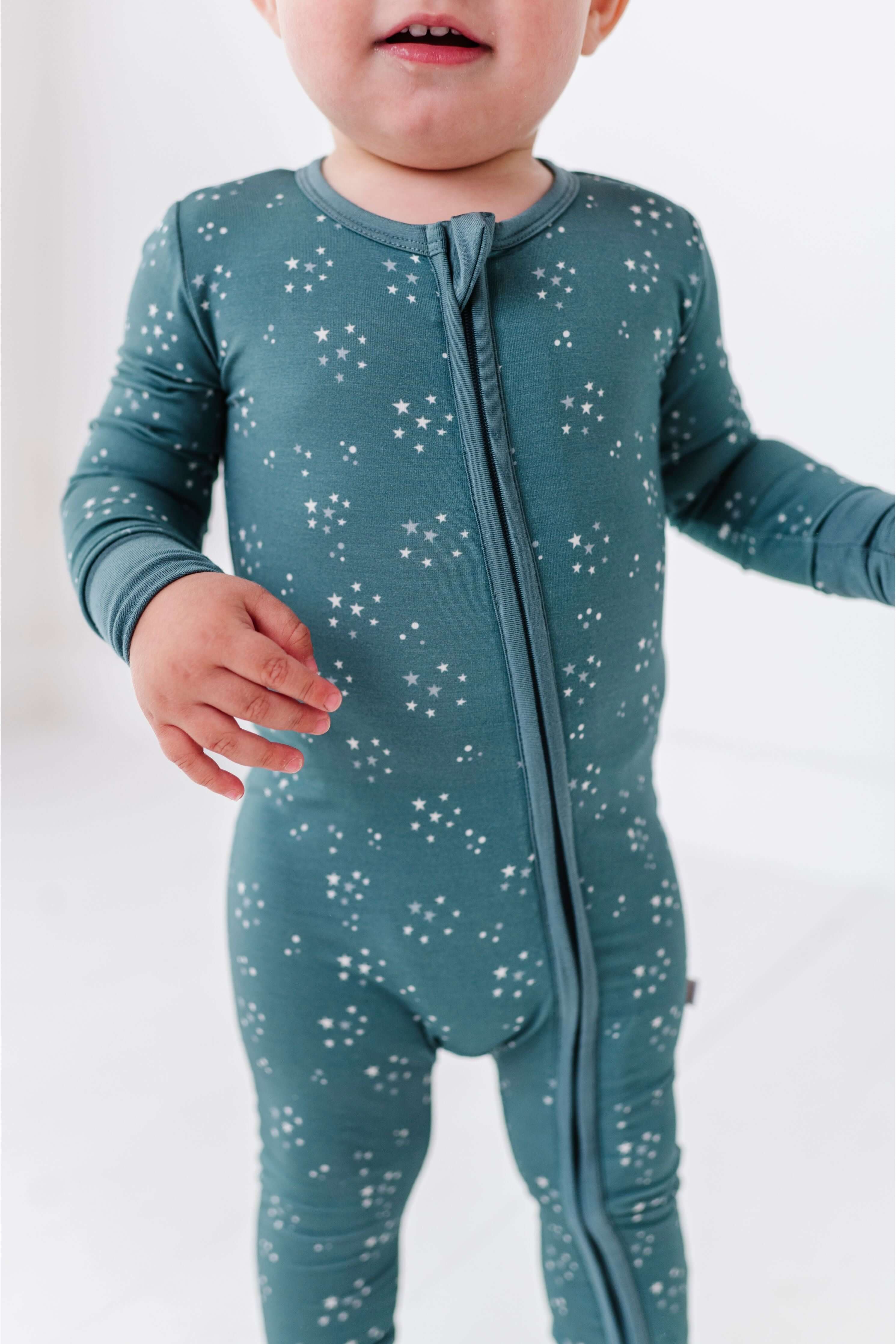 Starlit Sky | Bamboo One Piece Zip Pajama | An ultra-soft bamboo zip romper with an adorable star print, designed for comfort, breathability, and effortless diaper changes. Key Features: 🌱 Made from premium bamboo fabric – naturally soft and breathable �