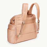 Caraa Baby Bag in blush nylon with adjustable straps and multiple pockets for organization.