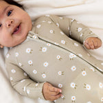Baby wearing Sage Floral | Zip Romper made of soft bamboo, featuring floral prints and a double zipper for easy diaper changes.