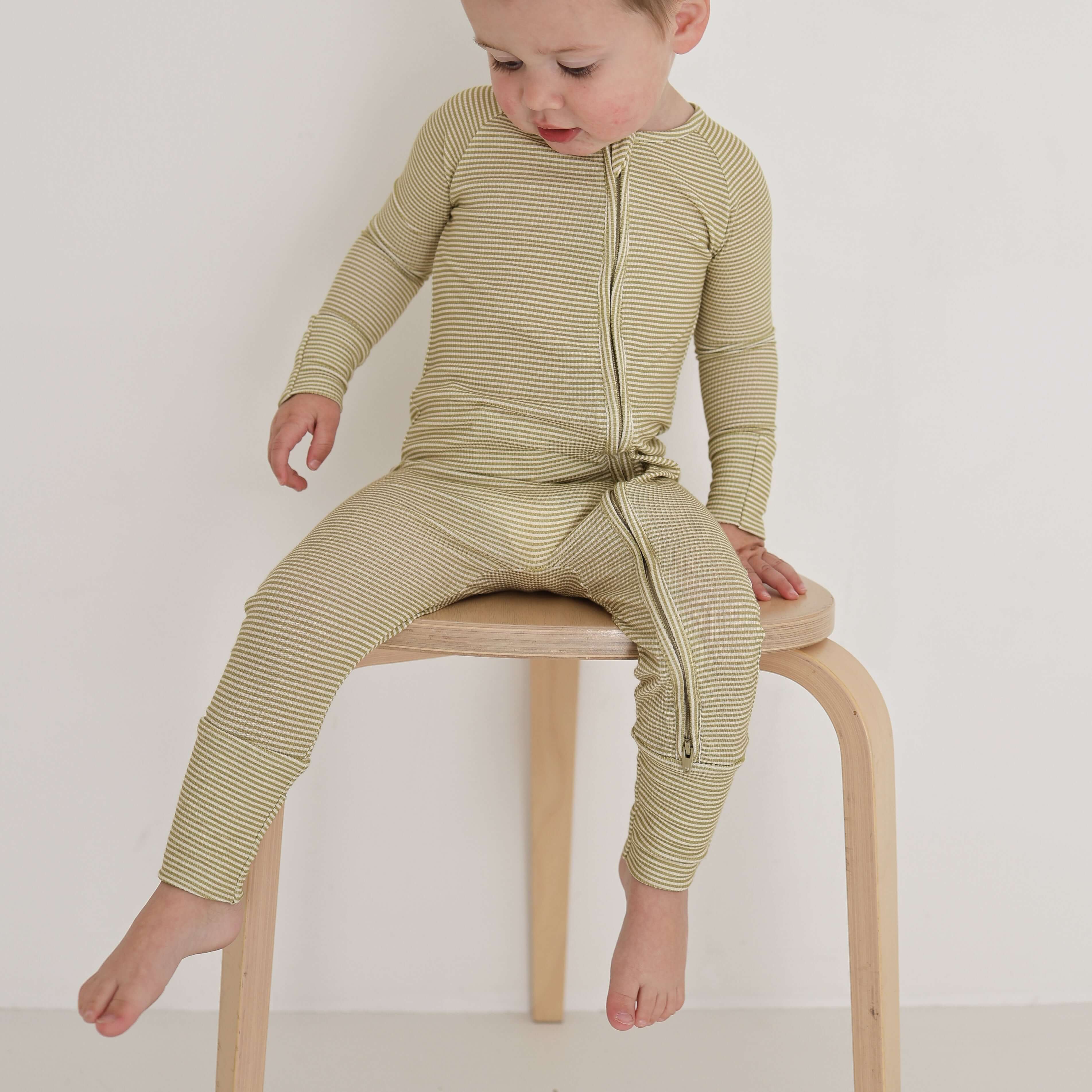 Willow Stripe Ribbed | Bamboo Zip Pajamas | Made of the softest premium bamboo. Durable and well designed your little ones can sleep and play in these cozy pajamas. All sizes have rollover cuffs on the hands and all of the one piece sizes have cuffs on th