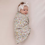 Sunny Petals Muslin Swaddle Blanket | Wrap your little one in the softness of our Sunny Petals Muslin Swaddle Blanket. Made from 100% Cotton, these blankets are as soft as butter and get even softer with each wash. Designed with both parents and babies in