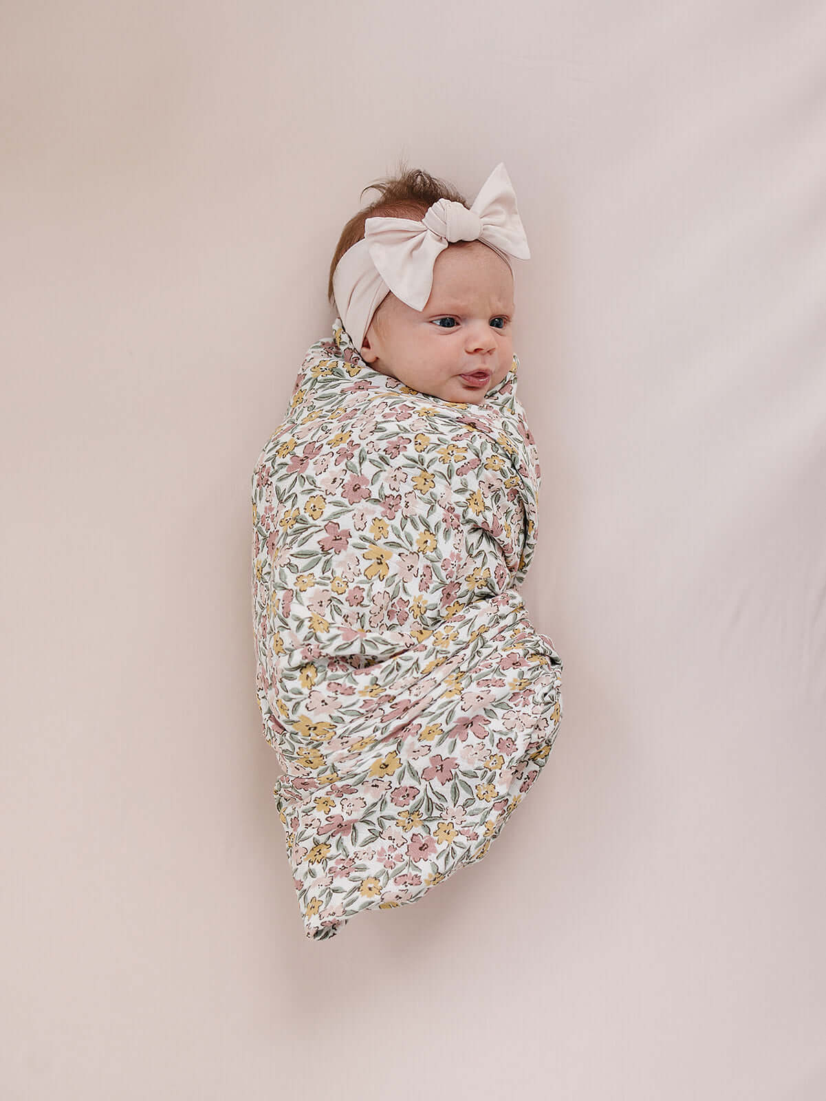 Sunny Petals Muslin Swaddle Blanket | Wrap your little one in the softness of our Sunny Petals Muslin Swaddle Blanket. Made from 100% Cotton, these blankets are as soft as butter and get even softer with each wash. Designed with both parents and babies in