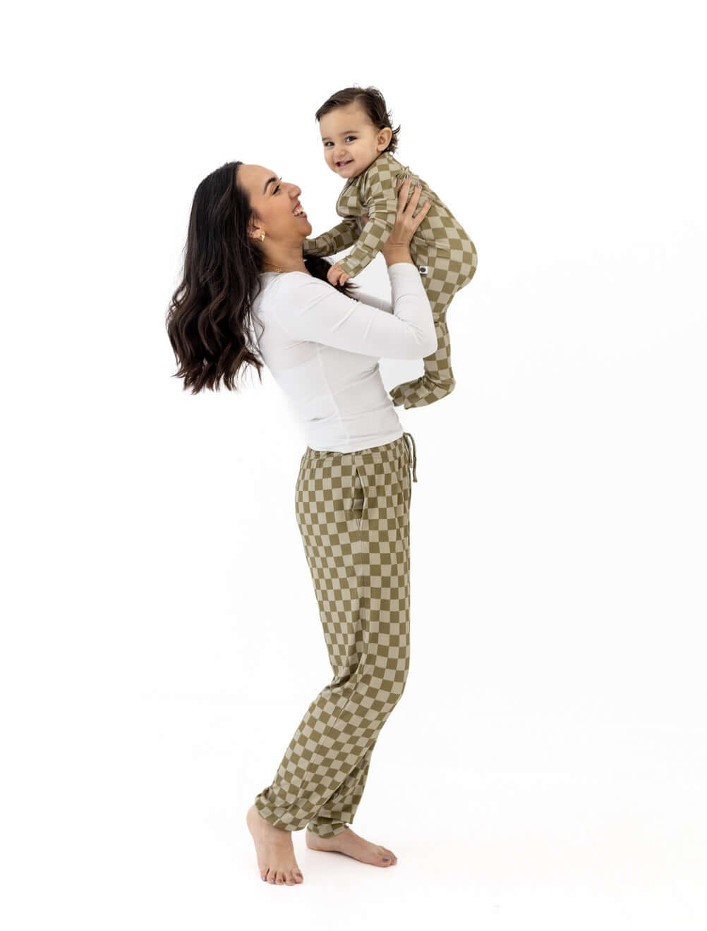 Mom holding baby wearing Sage Check | Zip Romper, showcasing comfort and style in a playful moment.