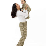Mom holding baby wearing Sage Check | Zip Romper, showcasing comfort and style in a playful moment.