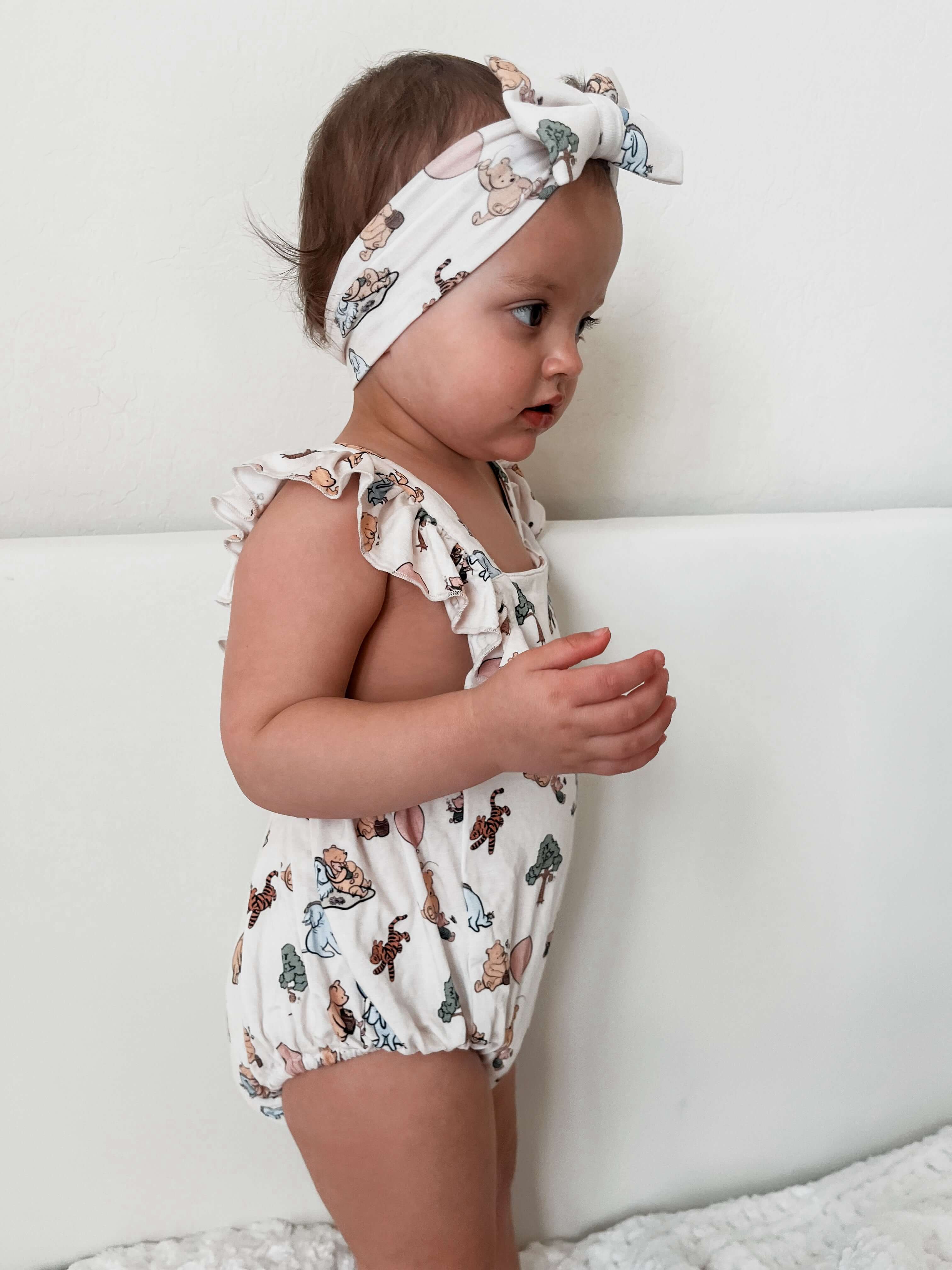 Pooh | Cross-Back Ruffle Romper | Milk & Baby