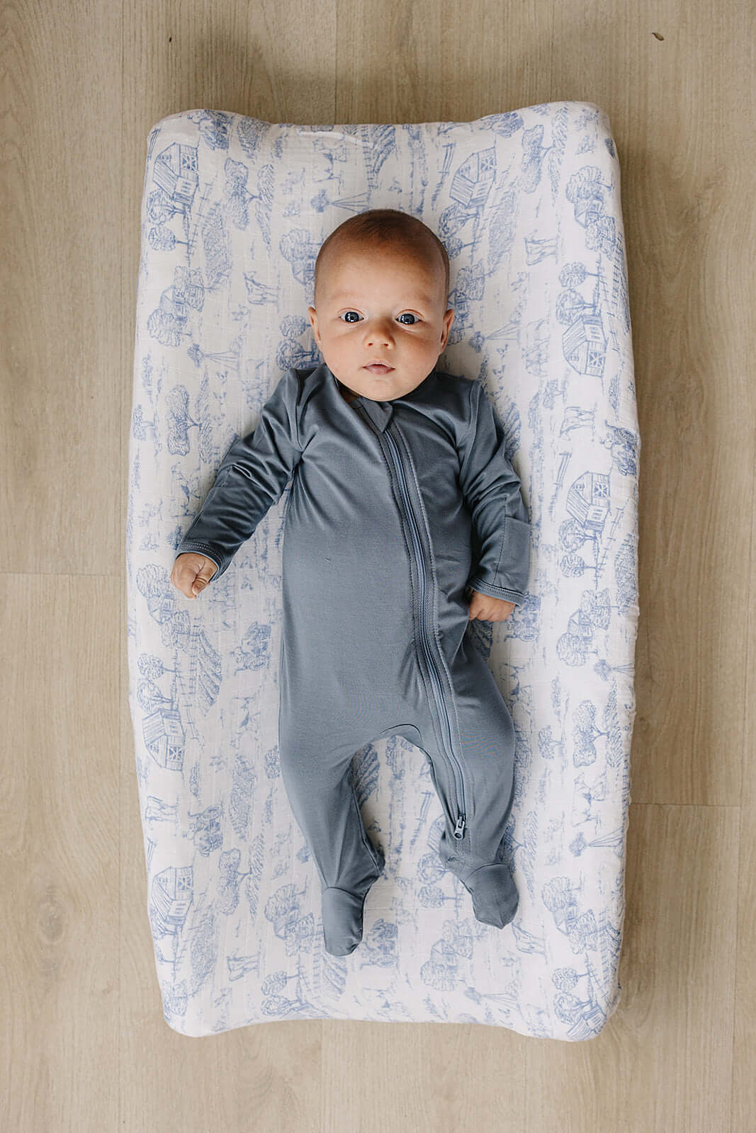 Farm Toile Muslin Changing Pad Cover | Transform your baby's changing area with the Mebie Baby Farm Toile Muslin Changing Pad Cover. Made from soft and breathable muslin fabric, this cover is gentle on your baby's skin. The fun design adds a touch of mode