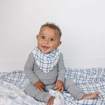 Farm Toile + Blue & Green Plaid Muslin Quilt | Indulge your little one in the cozy comfort of our Muslin Quilt. Crafted from the same fabric as our beloved muslin swaddles, this four-layer quilt offers warmth and softness for a restful sleep. Our neutral