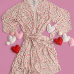 Blooms & Bows Women's Dream Robe with floral pattern and hearts on a pink background for a romantic look.