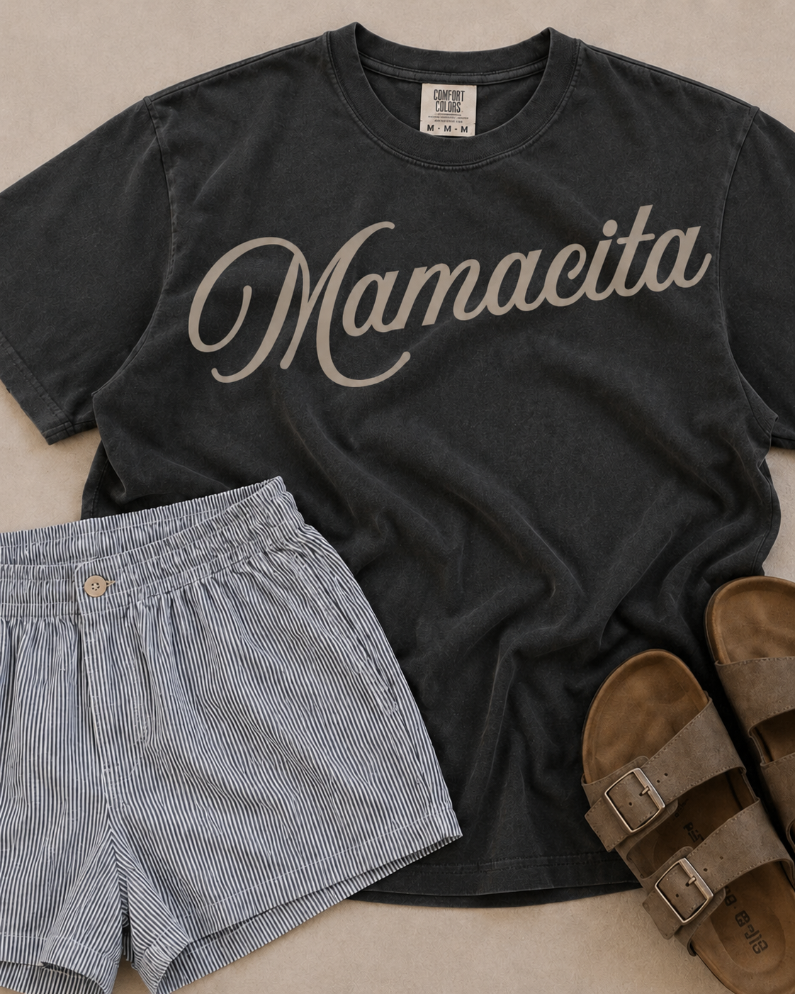 Mamacita Tee | A fun, effortless statement for the mamas who do it all with a little extra style. The Mamacita Tee is playful, flattering, and easy to wear on repeat. Printed on a 100% cotton Comfort Colors tee, it has the soft, lived-in feel and relaxed