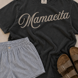 Mamacita Tee | A fun, effortless statement for the mamas who do it all with a little extra style. The Mamacita Tee is playful, flattering, and easy to wear on repeat. Printed on a 100% cotton Comfort Colors tee, it has the soft, lived-in feel and relaxed