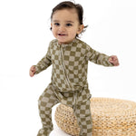 Sage Check | Zip Romper on a cute baby playing, showcasing its soft bamboo fabric and stylish design.