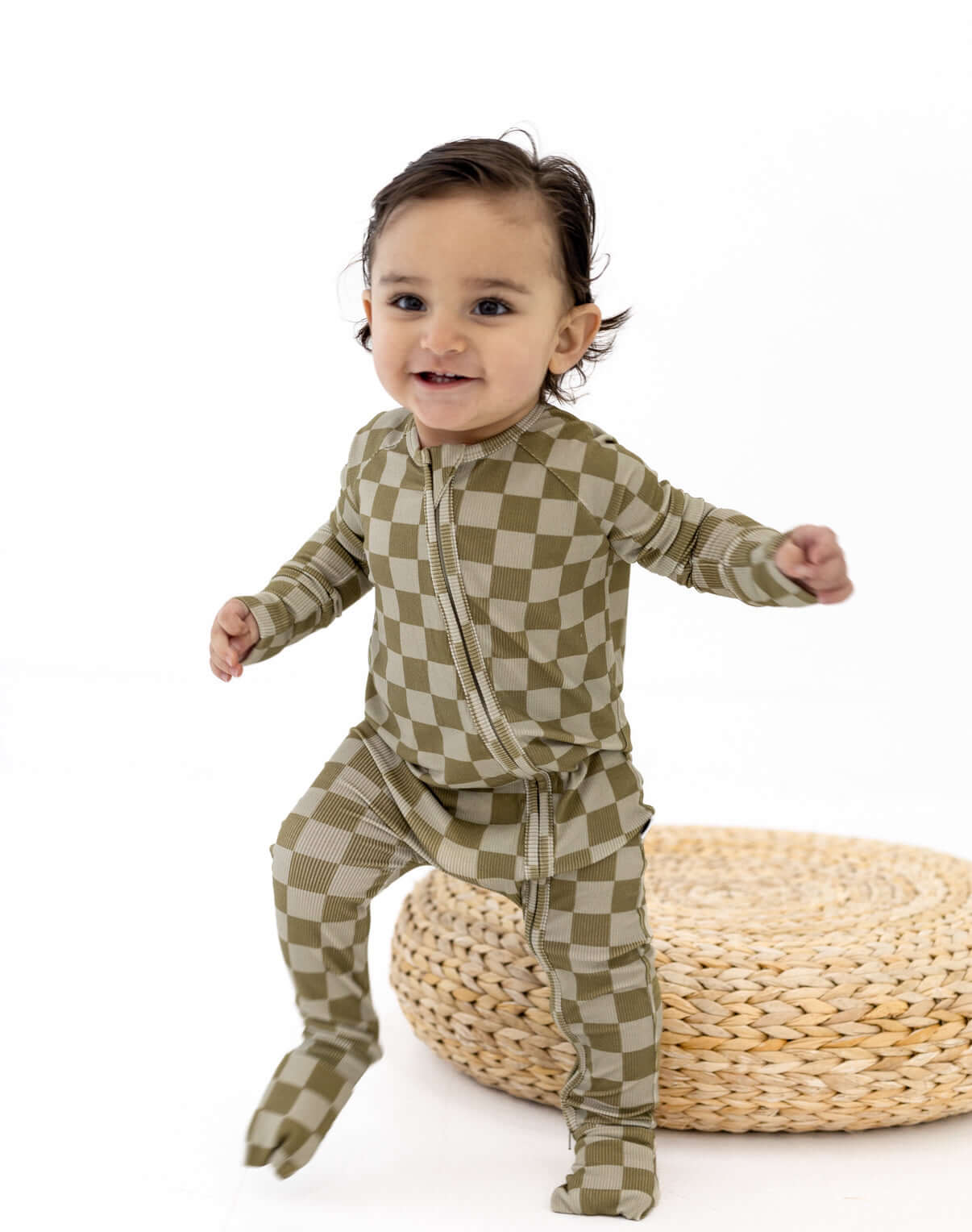 Sage Check | Zip Romper on a cute baby playing, showcasing its soft bamboo fabric and stylish design.