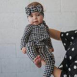 Black Gingham | Bamboo Head Wrap | Made from silky-soft bamboo material, this adjustable head wrap features a sweet bow for added style. Perfect for babies and toddlers!One size fits most Print: Black Gingham Material: 95% bamboo viscose / 5% spandex Care